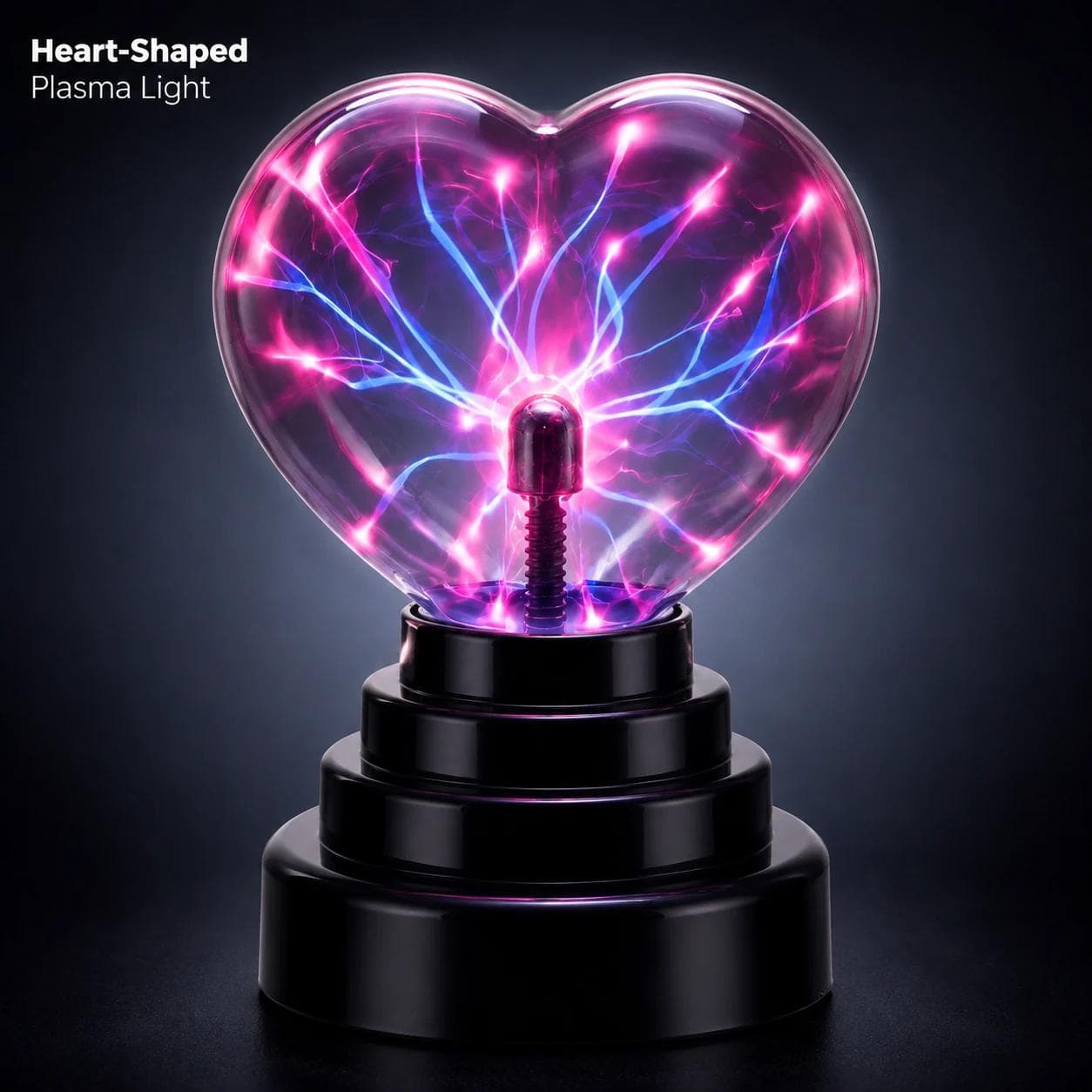 MX-7032 heart shaped plasma ball lamp with bright pink and blue electric plasma arcs on a black base