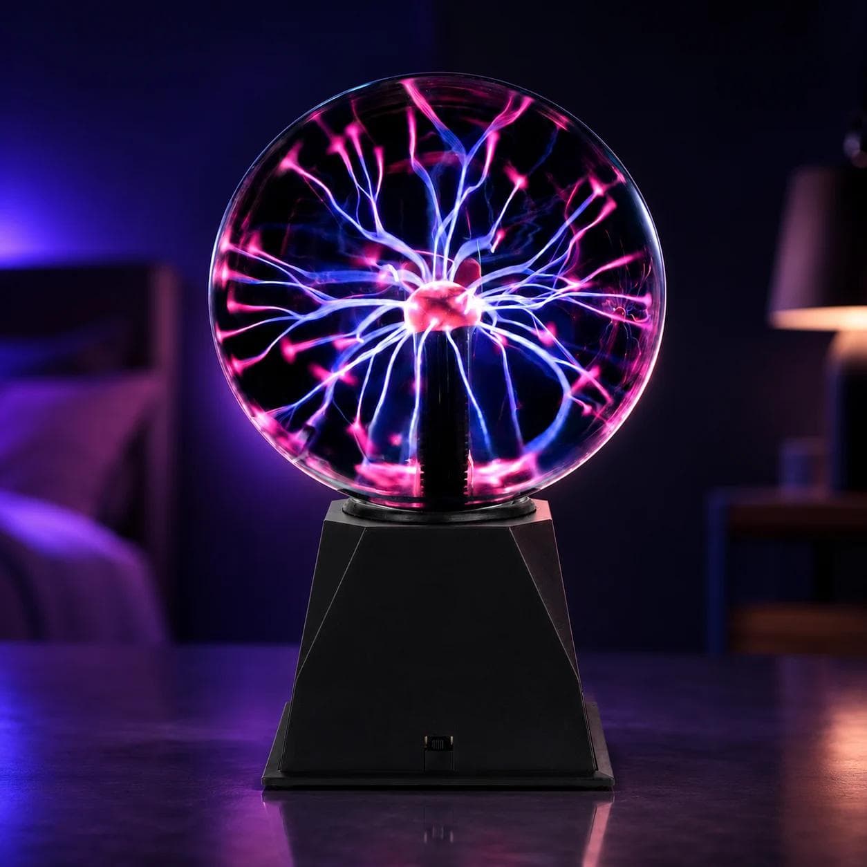 MX-7011 plasma ball LED night light with transparent glass sphere, pink and blue electric arcs, black base and front switch for bedroom or desk decor.