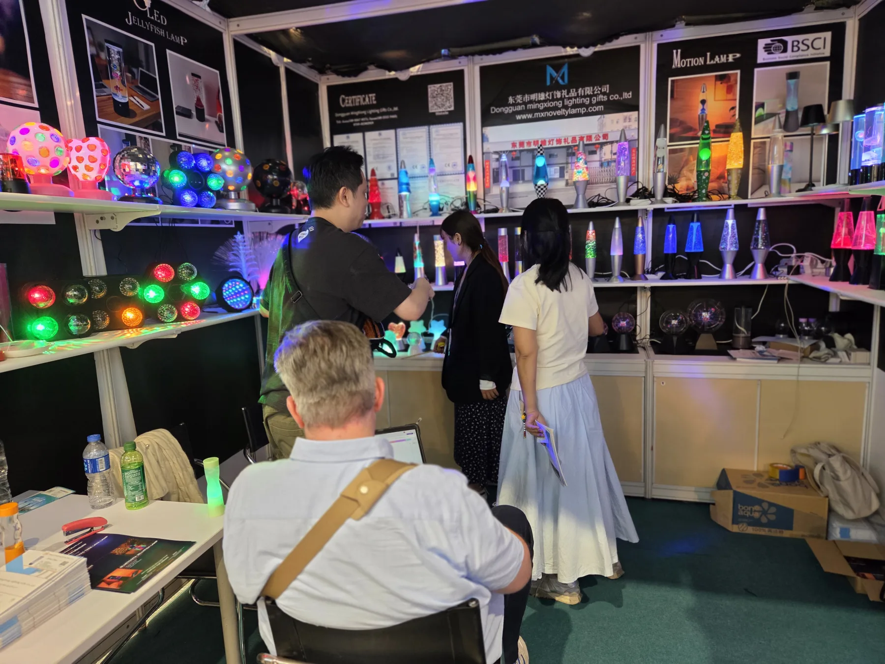 Buyers viewing novelty lamps at Mingxiong Lighting's 2026 Hong Kong trade-show booth