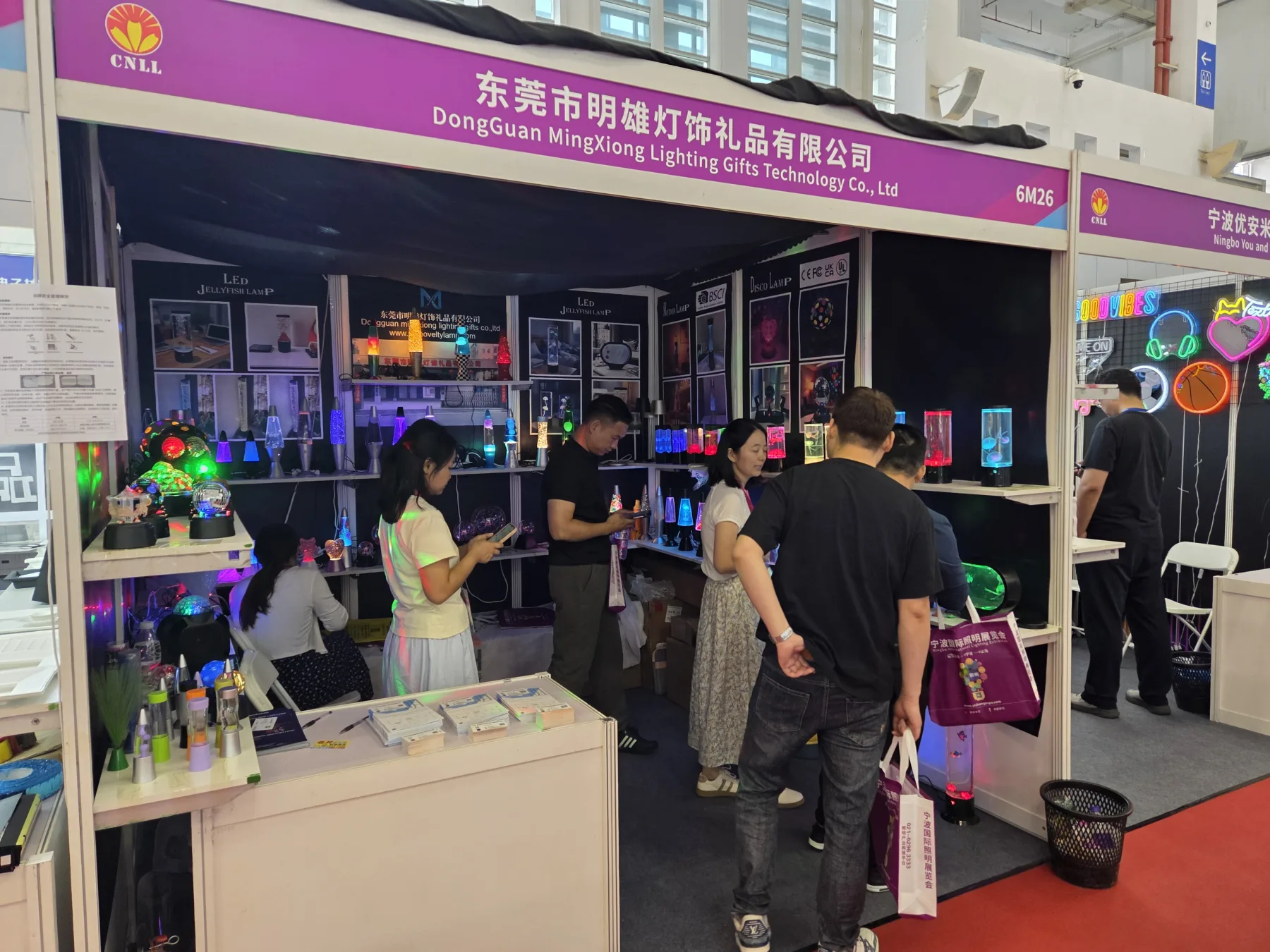 Visitors viewing Mingxiong Lighting products at the 2026 Ningbo lighting exhibition